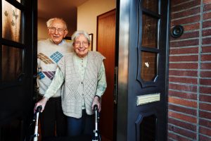 Older couple standing in doorway
