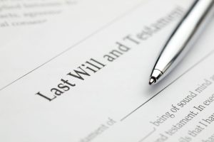 Picture of a Last Will and Testament with a ball point pen. 